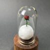 Mini lámpara de origami rosa del principito sobre luna iluminada con base de madera de teca - Plicatorius.